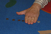 hand covering coins